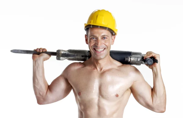 Healthy worker holding a pneumatic drill on white background. — Stock Photo, Image
