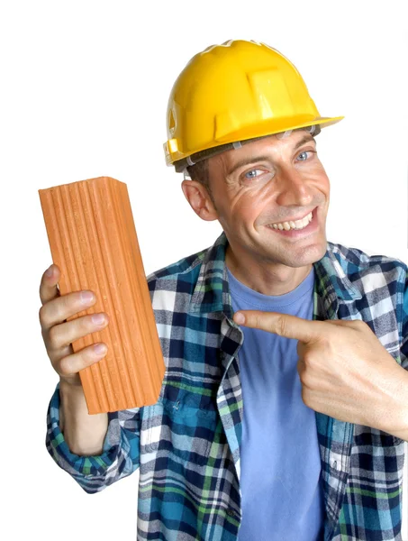 Construction man holding a wall brick on white background. — Stock Photo, Image