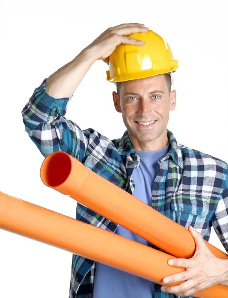 Plumber holding two plastic orange tubes — Stock Photo, Image