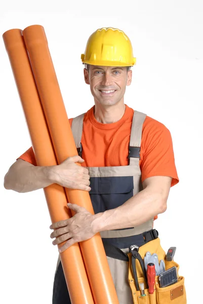 Plumber holding two plastic orange tubes — Stock Photo, Image