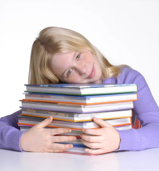 School girl portrait behind books. — Stock Photo, Image