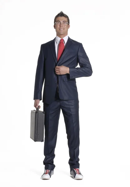 Young Businessman holding a briefcase on white background. — Stock Photo, Image