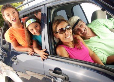 Hispanic family in a car. Family tour in a car.