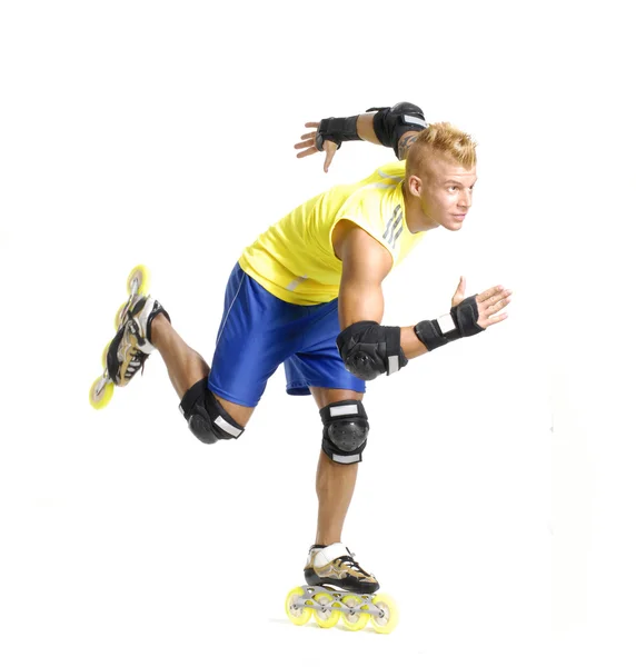 Sportive young man skating on white background. — Stock Photo, Image