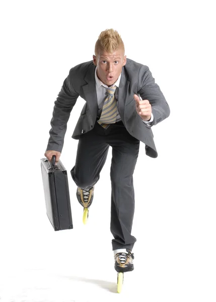 Joven empresario patinando sobre fondo blanco . —  Fotos de Stock