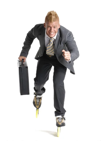 Joven empresario patinando sobre fondo blanco . —  Fotos de Stock