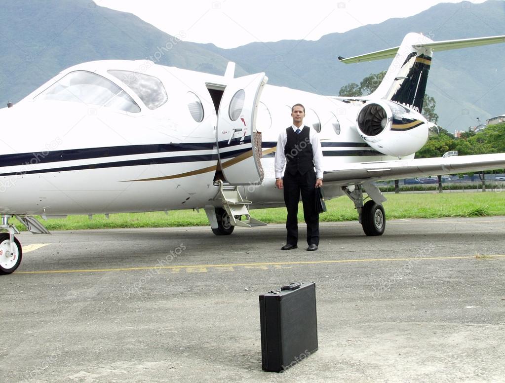 Businessman boarding a private jet