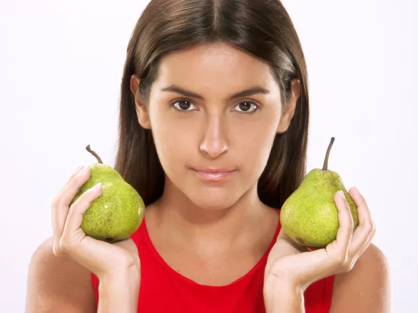 Young woman holding fresh pears. — Stock Photo, Image