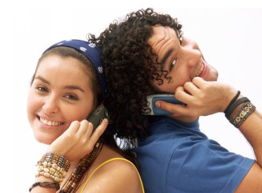 Young couple using a mobile phone. clipart