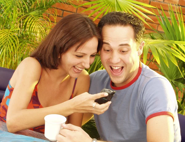 Young couple enjoying in a cafe — Stock Photo, Image