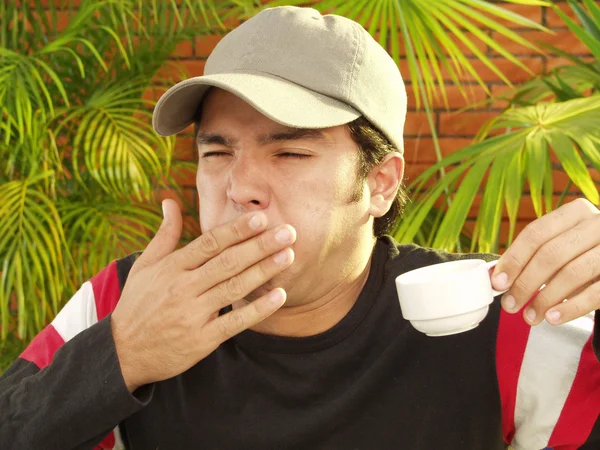 Expressive young man portrait drinking coffee. — Stock Photo, Image