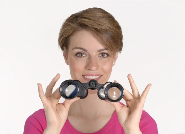 Young woman looking through binoculars. — Stock Photo, Image