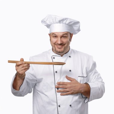 tahta kaşık tutan bir ahşap spoon.chef tutarak yemek.