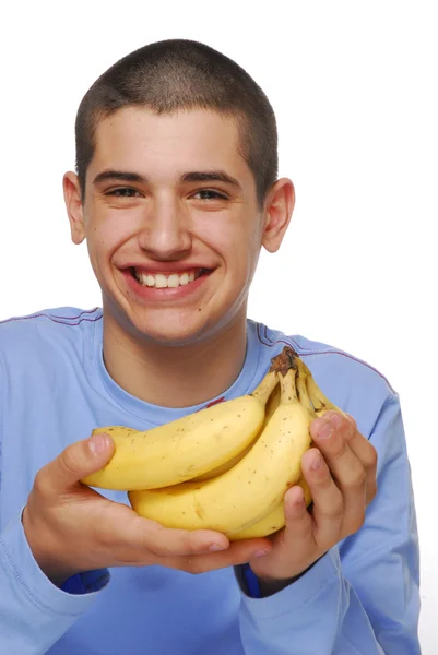 Joven sosteniendo un racimo de plátano sobre fondo blanco . —  Fotos de Stock