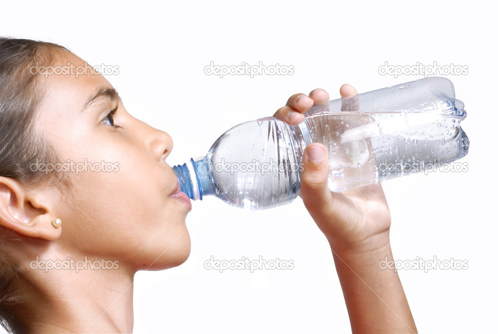 Little girl drinking mineral water bottle.