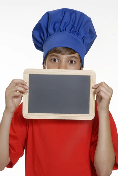 Little kid chef holding a school board,Kid holding blackboard. — Stock Photo, Image