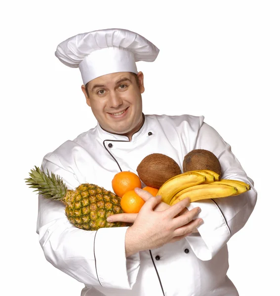Glücklicher Koch mit Früchten auf weißem Hintergrund. — Stockfoto