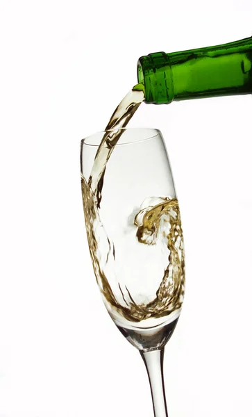 Pouring champagne on white background — Stock Photo, Image