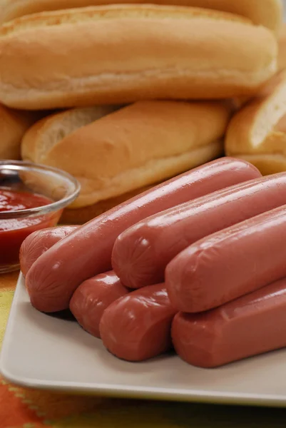 Sausages for hotdog on a dish — Stock Photo, Image