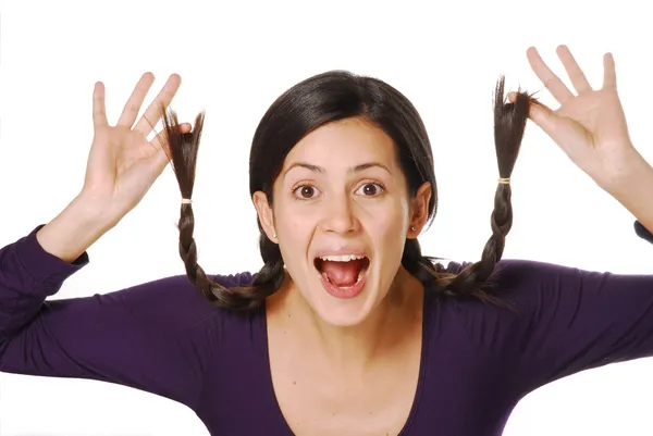 Funny and playful young girl touching her hair — Stock Photo, Image