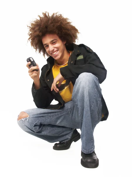 Afro estilo jovem usando um telefone celular — Fotografia de Stock