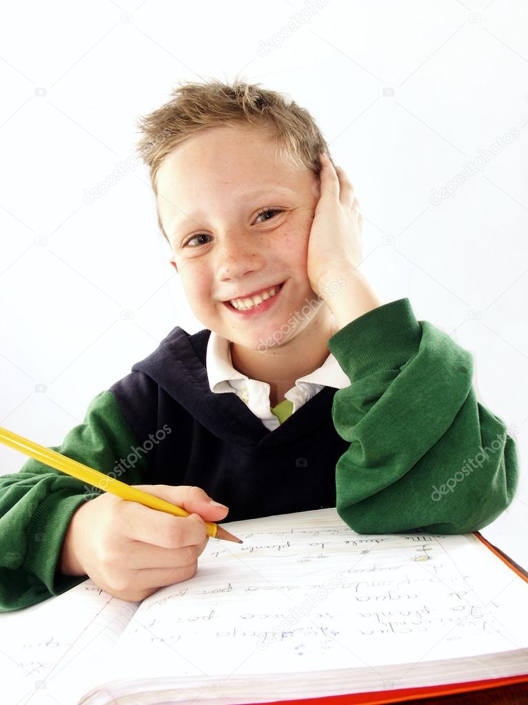 Little school kid on his desk