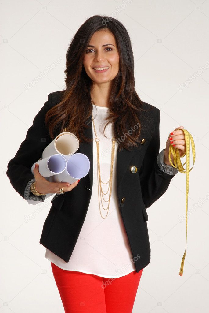 Young woman holding blueprints.