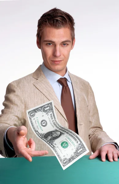 Young businessman agent giving one dollar bill. — Stock Photo, Image