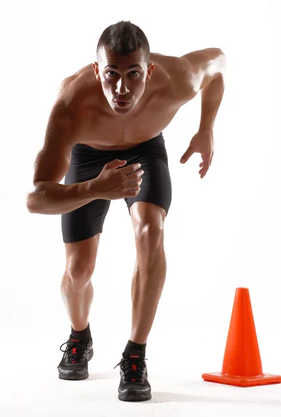 Hombre sano y fitness corriendo sobre fondo blanco . — Foto de Stock