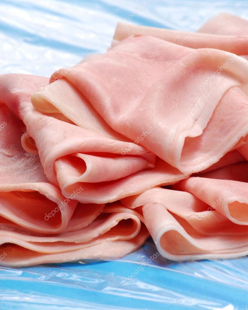 Prosciutto ham slices detail.Slices of ham. — Stock Photo