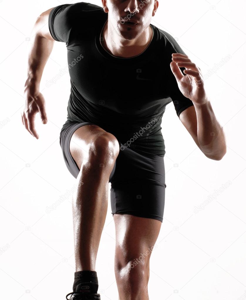 Healthy and fitness man running on white background.