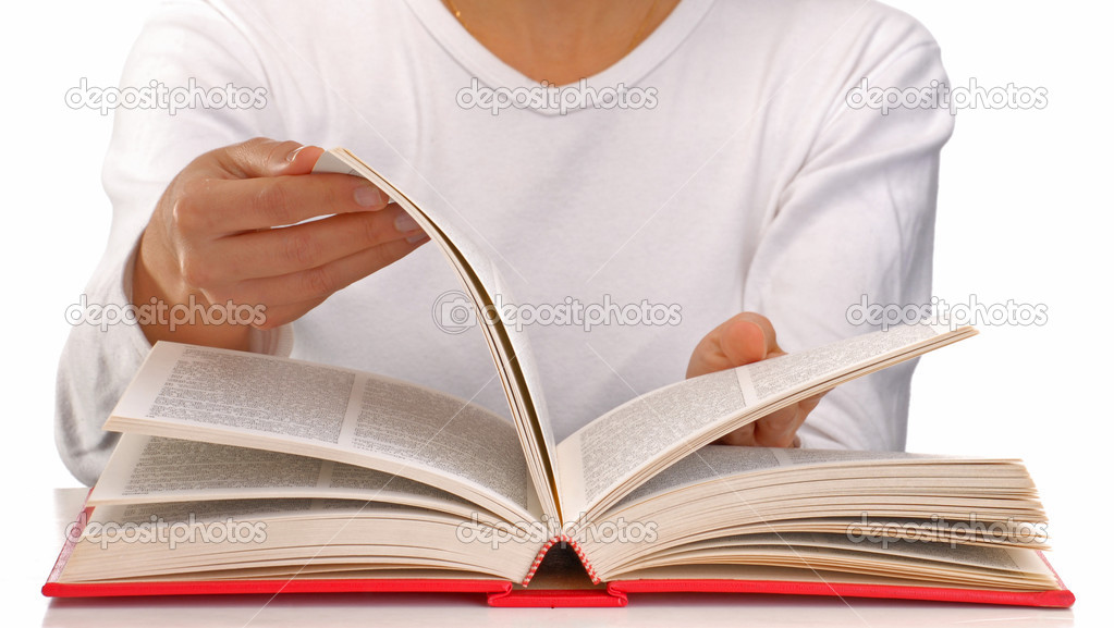 Young woman reading a book on white background.