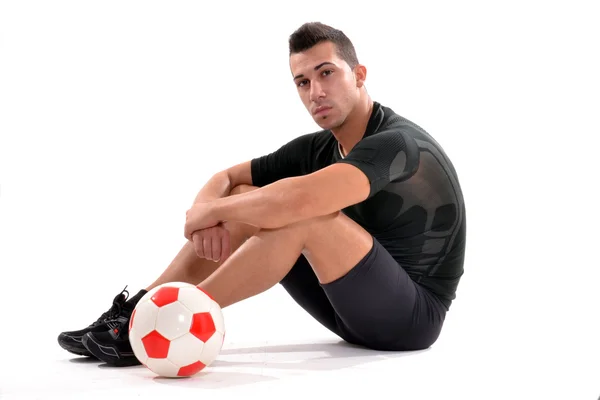 Fitness soccer player and a soccer ball. — Stock Photo, Image