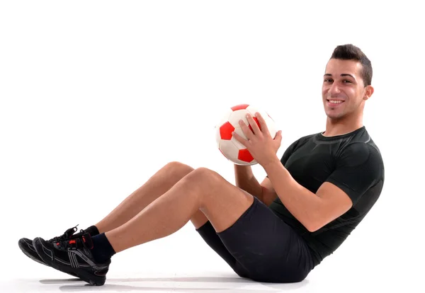 Fitness soccer player and a soccer ball. — Stock Photo, Image