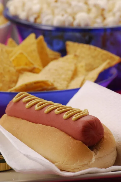 One hotdog,nachos and popcorn. Fast food composition. — Stock Photo, Image