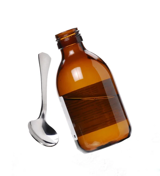 One Syrup bottle and teaspoon. — Stock Photo, Image