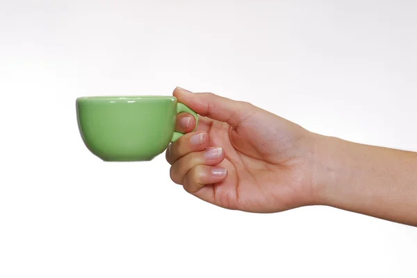 Um youg mão feminina segurando um copo . — Fotografia de Stock