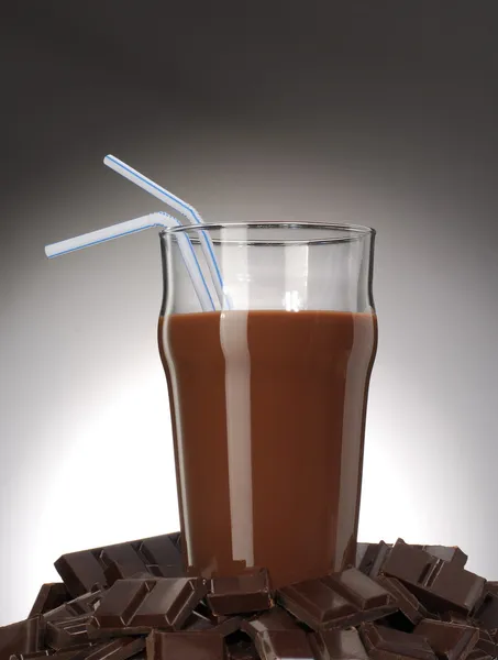 Fresh chocolate drink over chocolate sticks. — Stock Photo, Image