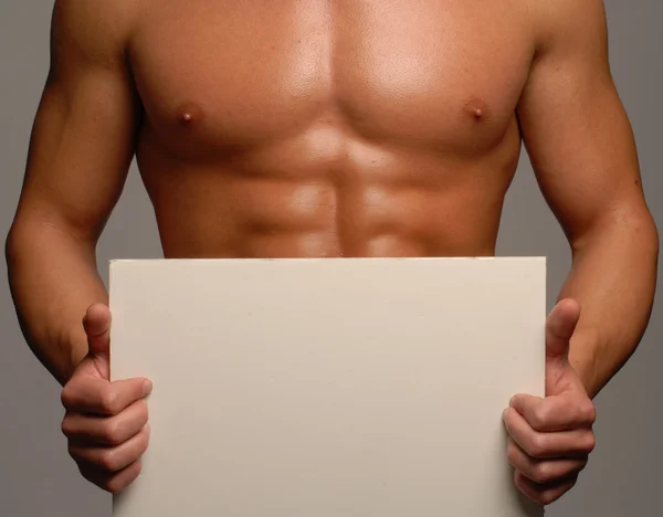 Homem segurando um painel branco — Fotografia de Stock