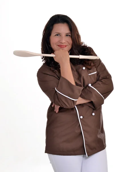 Happy woman chef holding a wood spoon. — Stock Photo, Image