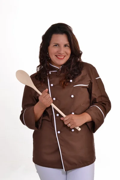 Щаслива жінка шеф-кухаря тримає дерев'яну ложку . — стокове фото