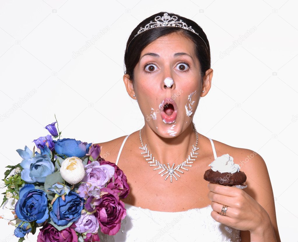 Funny bride eating cake