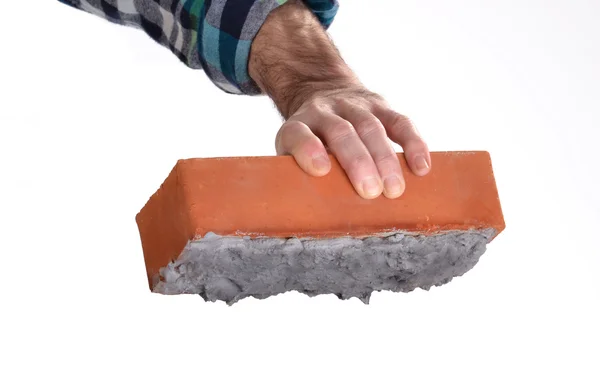 Constructor worker holding a cement construction brick. — Stock Photo, Image