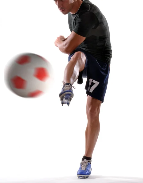 Soccer player kicking soccer ball. — Stock Photo, Image