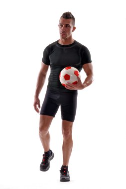Fitness futbolcu ve futbol topu.