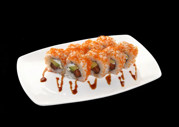 Rollos de sushi en un plato — Foto de Stock