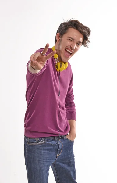 Happy guy wearing yellow headphones. — Stock Photo, Image