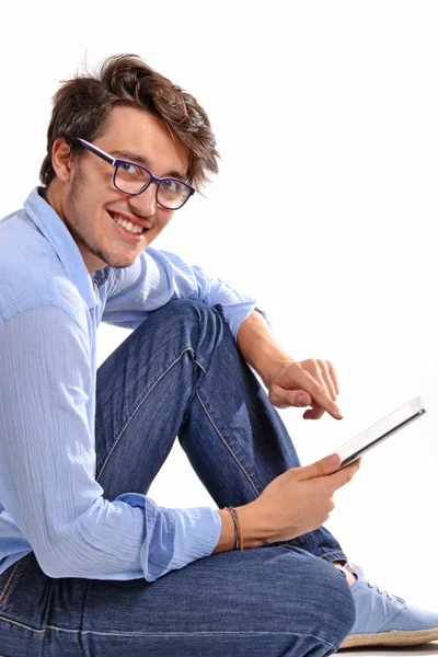 Young student using a tablet — Stock Photo, Image