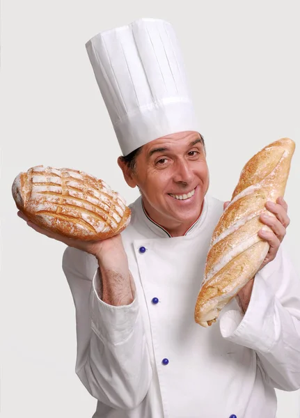 Baker Cook Holding Two Big Breads Hand White Background Portrait — Stock Photo, Image