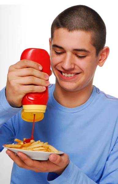 Happy Kid Pouring Tomato Sauce French Fries Potatoes Dish White — Stock Photo, Image